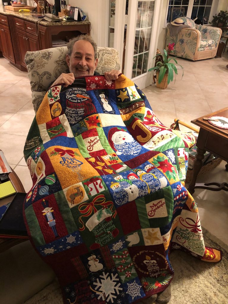 David is nice and cozy under our Christmas Classics Quilt 2020